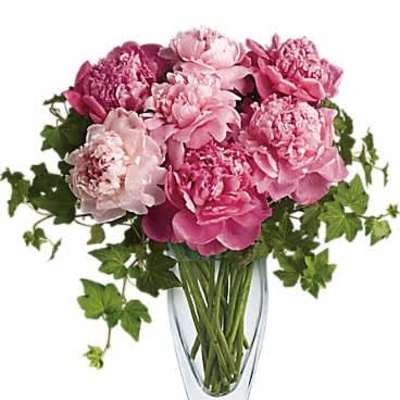 Pink peony bouquet in a clear glass vase