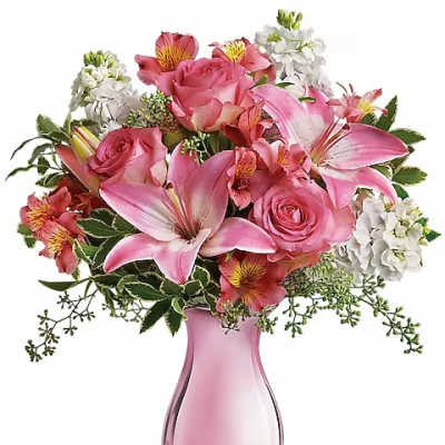 Pink roses and lilies in a pink glass vase