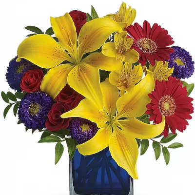Bouquet of yellow lilies, red gerbera daisies, and purple flowers in a blue vase