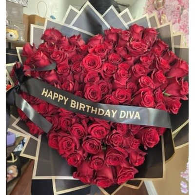 Large bouquet of red roses with a birthday ribbon