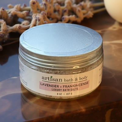 Jar of lavender and frankincense bath salts on a table