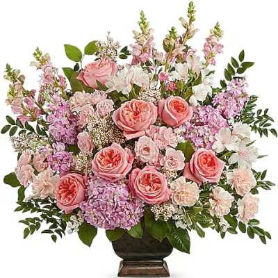 Pink and white floral arrangement in a dark vase