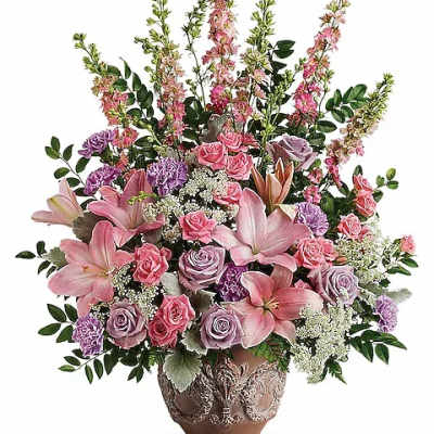 Pink and lavender floral arrangement in a decorative vase
