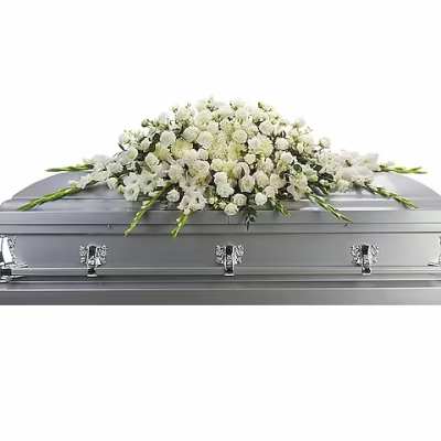 White floral spray on a silver casket