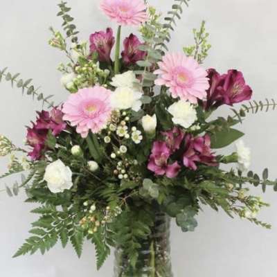 Pink and white mixed bouquet in a glass vase