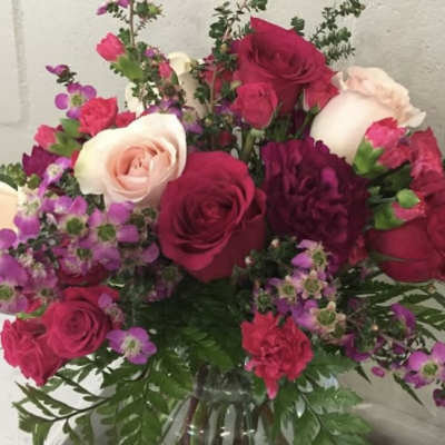 Bouquet of pink and white roses in a glass vase