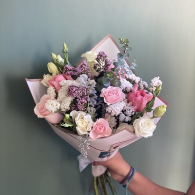 Pink and white rose bouquet with purple filler flowers and eucalyptus