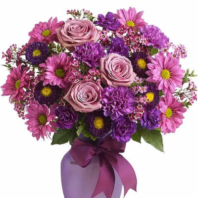 Pink and purple bouquet in a lavender vase with a ribbon