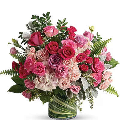 Pink and red rose bouquet in a glass vase