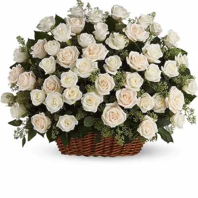 Basket of white roses with pale blush centers