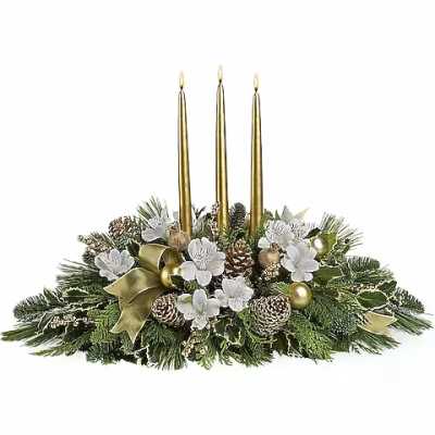 Holiday centerpiece with three gold candles and white flowers