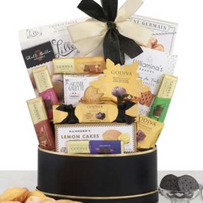 Gift basket of assorted chocolates and cookies tied with a ribbon
