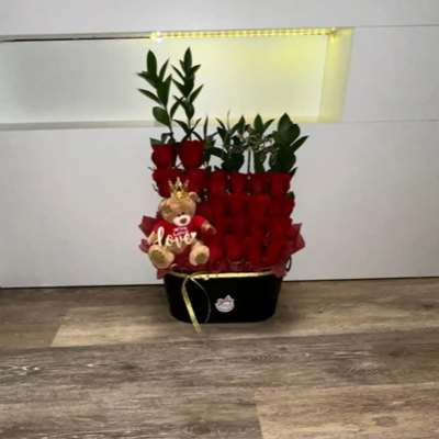 BEAUTIFUL DETAIL OF NATURAL ROSES WITH TEDDY BEAR