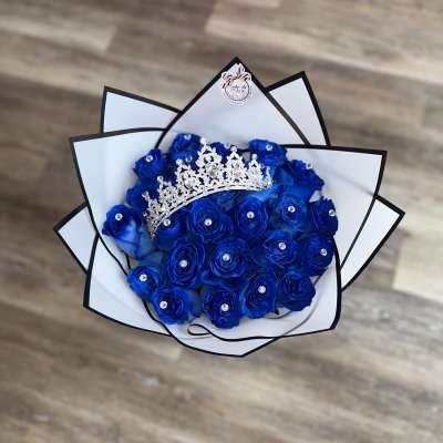 Blue rose bouquet with a jeweled tiara and white-black wrap