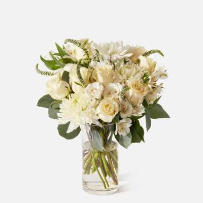 White floral bouquet in a clear glass vase