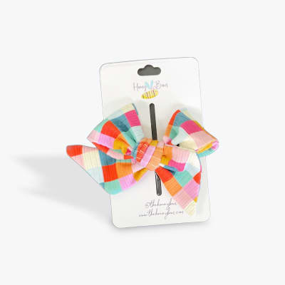 Colorful striped hair bow on a retail card