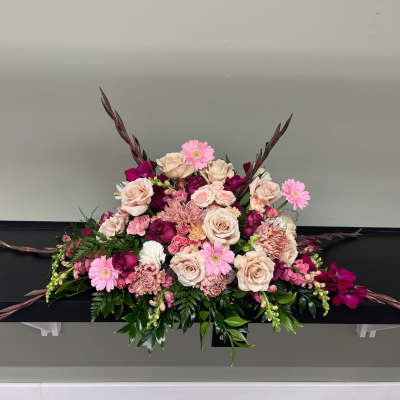 Large pink and cream floral arrangement with roses and gerbera daisies