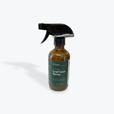 Amber spray bottle labeled leaf care spray