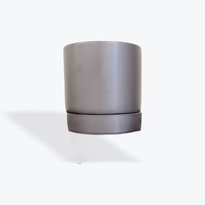 Gray cylindrical planter pot on a white background