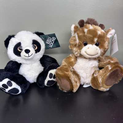 Two plush stuffed animals, a panda and a giraffe, sitting side by side