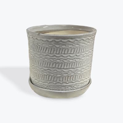 Textured ceramic planter in light gray with a matching saucer