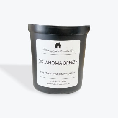 Black candle jar labeled Oklahoma Breeze