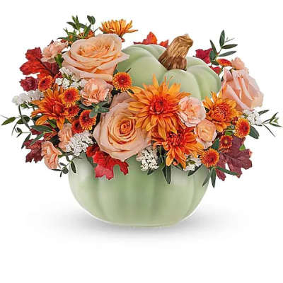 Pumpkin-shaped vase with peach and orange flowers