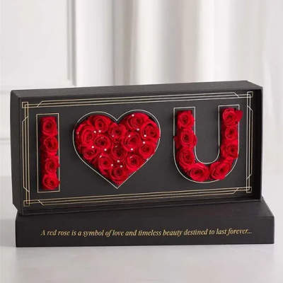 Black display box with red roses arranged as I love you