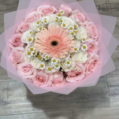 Pink and white bouquet with a peach gerbera daisy in pink wrap