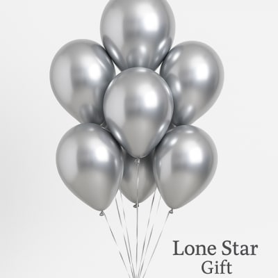 Cluster of metallic silver balloons with strings attached