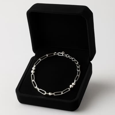 Silver chain bracelet in a black jewelry box