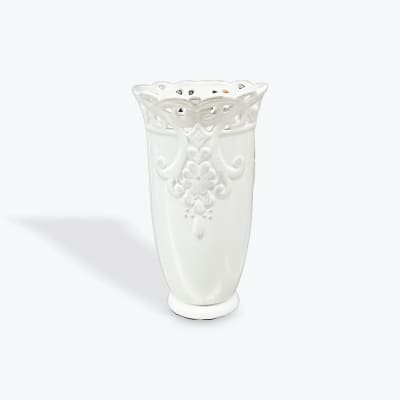 White decorative ceramic vase with embossed floral detailing