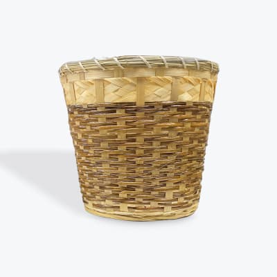 Empty woven wicker basket on a white background