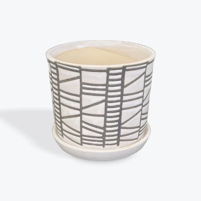 White ceramic planter with gray geometric lines and a matching saucer