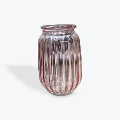 Clear ribbed glass vase on a white background
