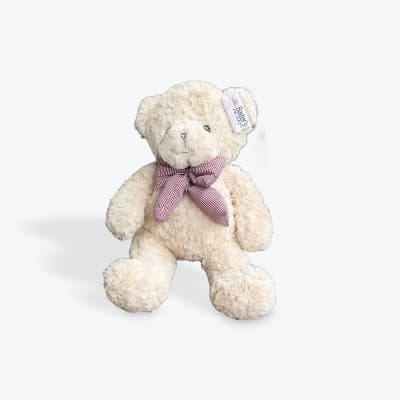 Cream teddy bear with a red checkered bow