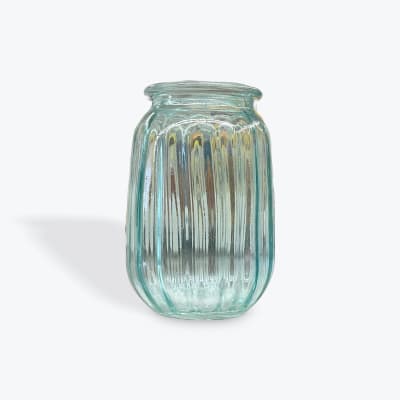 Empty ribbed glass vase in pale blue-green