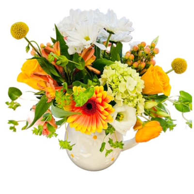 Colorful mixed bouquet in a white ceramic pitcher vase