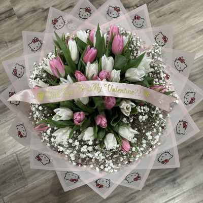 Pink and white tulip bouquet with a Valentine ribbon and Hello Kitty wrap