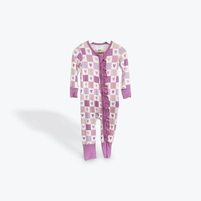 Pink and white heart-patterned baby onesie with ruffle trim
