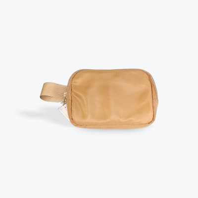 Tan zippered pouch with a wrist strap on a white background