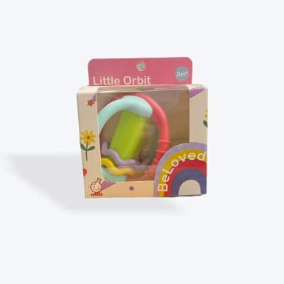 Boxed baby toy with colorful rings and a rainbow graphic