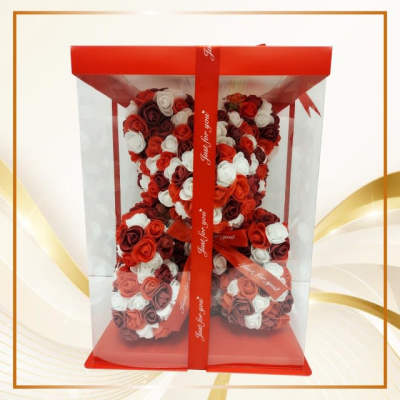Heart-shaped rose teddy bear in a red gift box