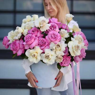 Large bouquet of pink and white roses in a pale blue box