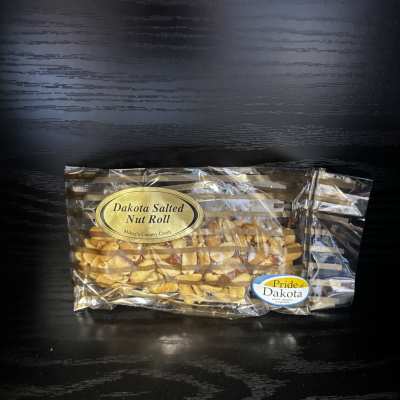 Bag of Dakota Salted Nut Roll candy on a dark surface
