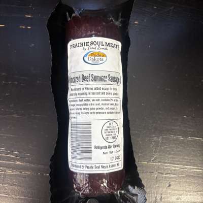 Packaged beef summer sausage in black wrapping