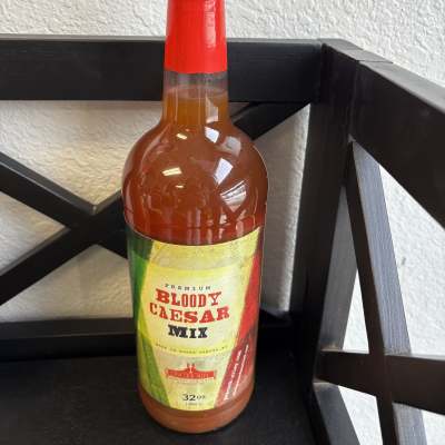 Bottle of Bloody Caesar mix with a red cap