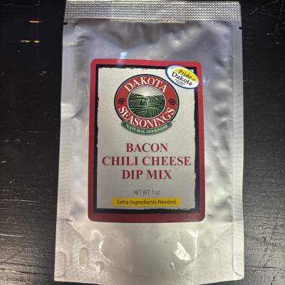 Packet of bacon chili cheese dip mix in a silver pouch