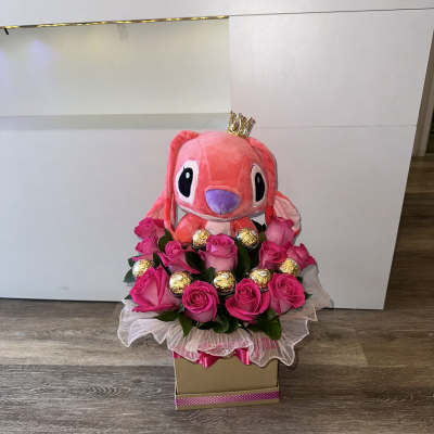 beautiful fuchsia flowers, pink Stitch, Ferrero Rocher chocolates encapsulated in acrylic