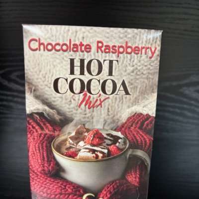 Chocolate raspberry hot cocoa mix box on a dark surface